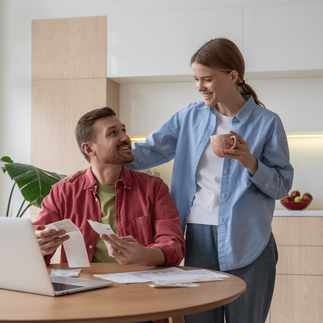 Couple happy and they are using mortgage interest tax credit calculator to understand how much tax they can get back